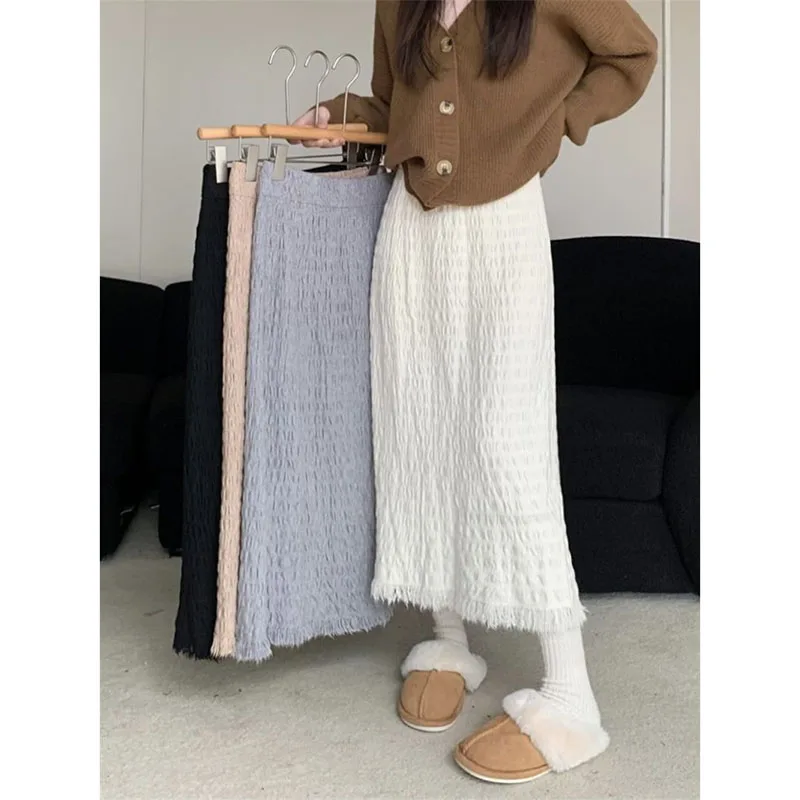 Vintage gebreide rokken voor dames mode streetwear hoog getailleerde ruwe rand a-lijn rokken vrouw veelzijdige losse effen lange rok