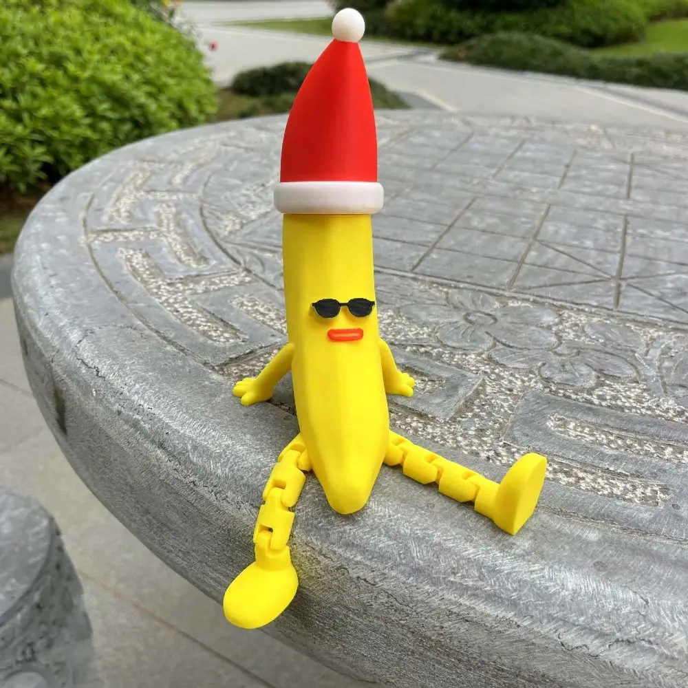 

Christmas Hat 3D Printed Banana Toy Multi-Jointed Movable Multi Joint Banana Toys Novelty Model Doll Banana Shaped Figurine Toy