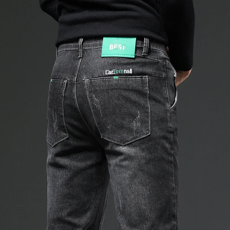秋と冬の新作伸縮性のあるルーズフィットペンシルパンツファッションブランドデニムメンズジーンズカジュアルハーランパンツ