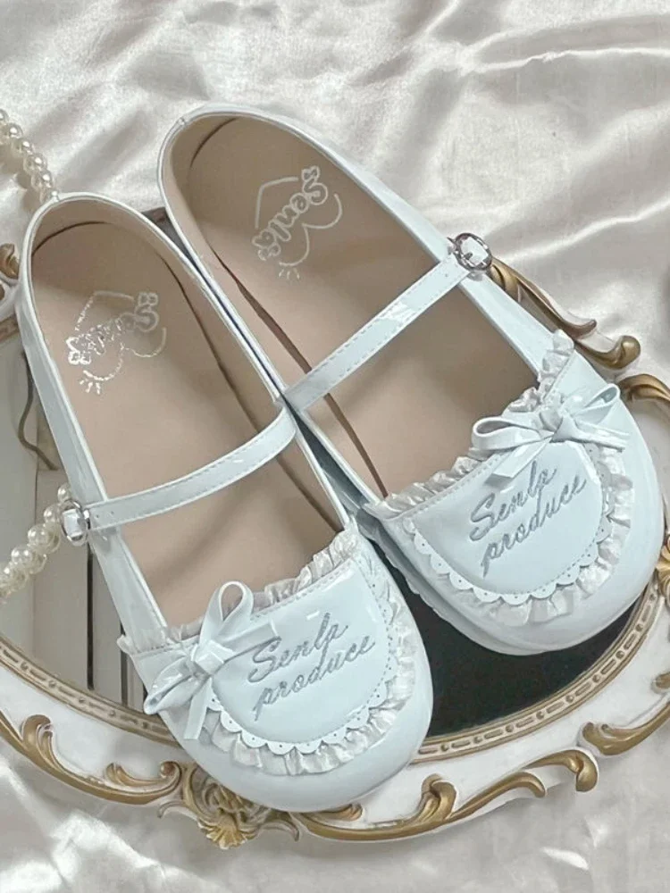 Oryginalne płaskie buty Kawaii Sweet Style Women New Japanese Cute Round Head Shoes Female Bow Letters Design Lolita Single Shoes