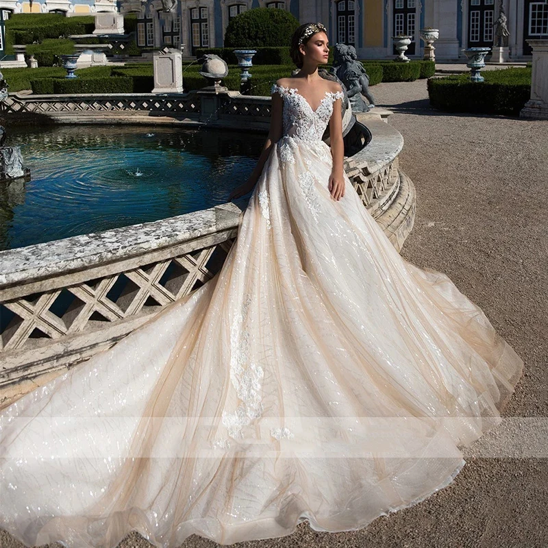 セクシーでゴージャスな A ラインのウェディングドレス女性のエレガントで甘いビーズレースアップリケブライダルドレスプリンセスビーチパーティーボール