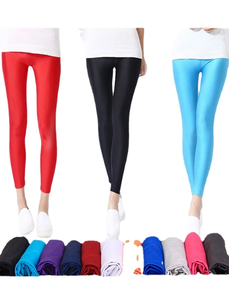 Kobiety błyszczące spodnie legginsy gorąca sprzedaży legginsy w jednolitym cukierkowym kolor fluorescencyjny elastan elastyczność spodnie typu Casual Shinny Legging