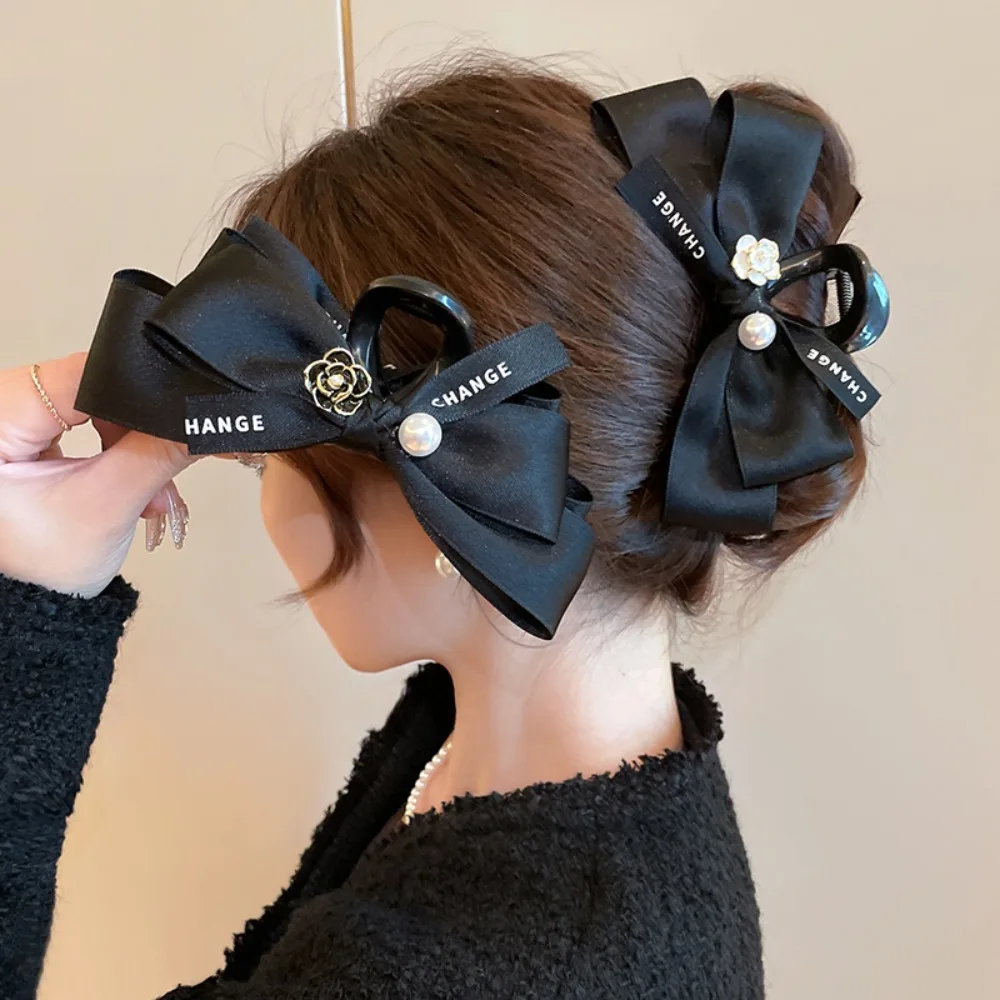 

Silk Satin Bow Hair Clip with Camellia Pearl Letter Design – Trendy Lightweight Luxury Stylish Hair Accessory for Daily Looks