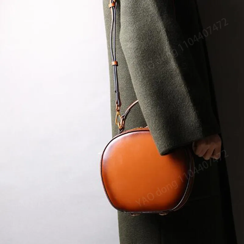 Yao dong bolsa de couro 2024 novo couro feminino retro maçã saco ombro único crossbody portátil moda pequenos sacos redondos