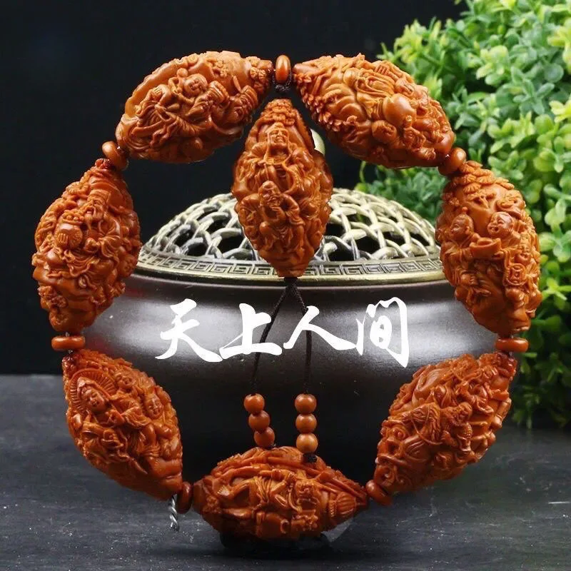 

Olive pit bracelet, a masterpiece of artistry, with large carved olive pits, a men's hand accessory