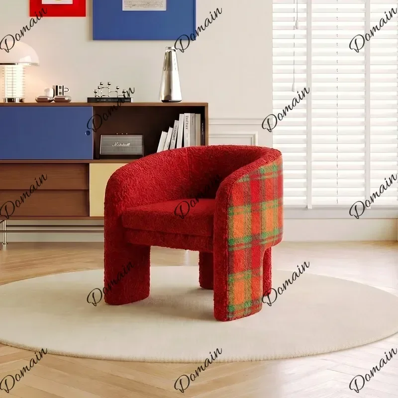 Modern Polka dot single sofa chair with curved armrests and designer creative style