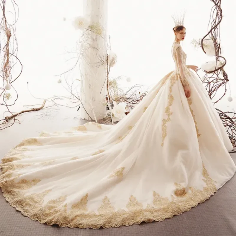 Customized Wedding Dress For 2025 Deep V-Neck Long Sleeves Beige Color Gold Lace Decal Large Skirt Backless Gorgeous Retro Style