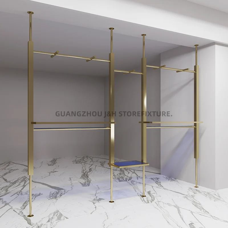 ราวแขวนเสื้อผ้าติดผนังแบบกำหนดเอง สำหรับร้านขายเสื้อผ้าผู้หญิง ทำจากสแตนเลสสตีลสีทองไทเทเนียม