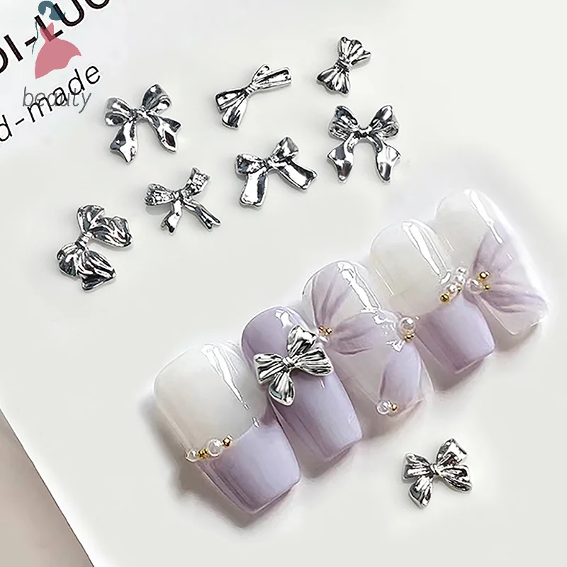 10 szt. Karuzeli do paznokci Bowknot Metal 3D ozdoby do paznokci srebrzysty akcesoria ze stopów Manicure Rhinestone diamentowa biżuteria Salon artystyczny do paznokci