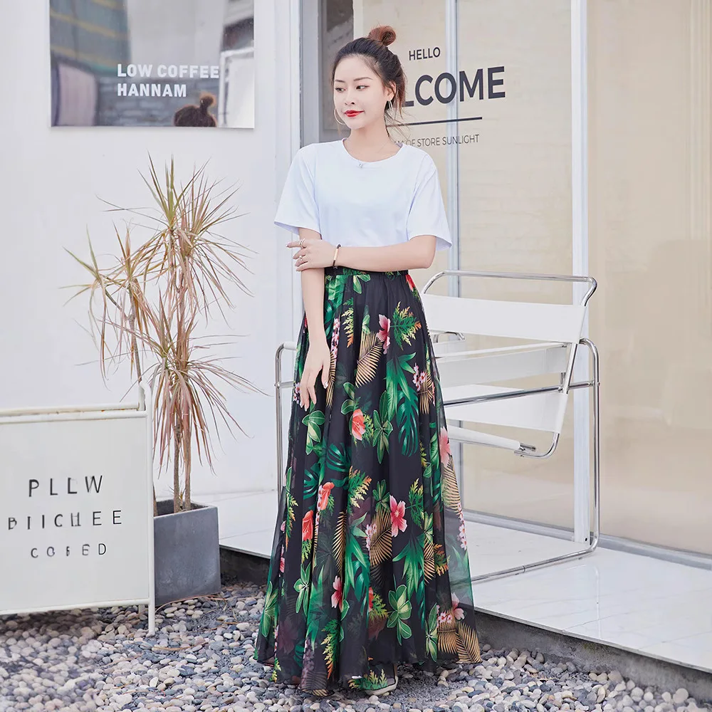 تنورة نصفية كاجوال مطبوعة بالزهور للنساء صيفية بنمط جديد لقضاء عطلة الشاطئ تنورة طويلة متأرجحة كبيرة بطول منتصف الساق لموسم ا...