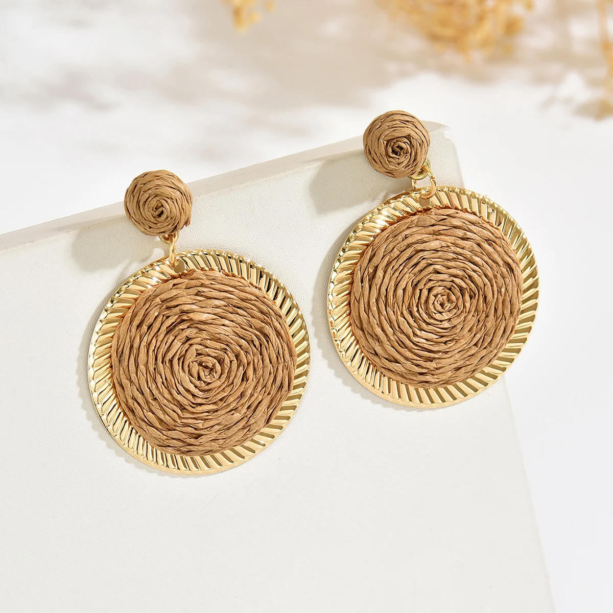 Bohemian-style, minimalist, vacation-inspired, hand-woven raffia round pendant earrings, perfect for women to wear on a daily ba
