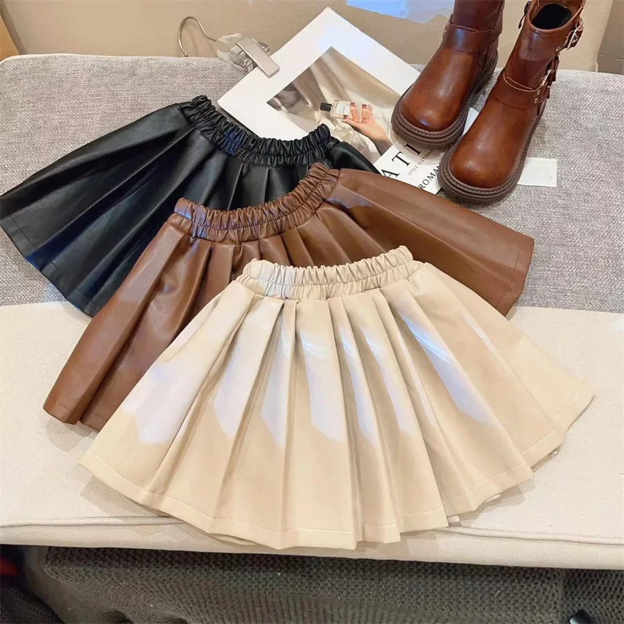 Children clothing autumn and winter new baby girl PU leather skirt Korean version half skirt solid color girl pleated skirt