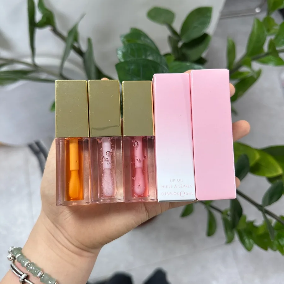 ฉลากส่วนตัวแต่งหน้ามังสวิรัติขายส่ง Lip Oil ช่วยลดความชุ่มชื้นแห้งลิปกลอส Plant Based Lip Care โลโก้ที่กําหนดเอง