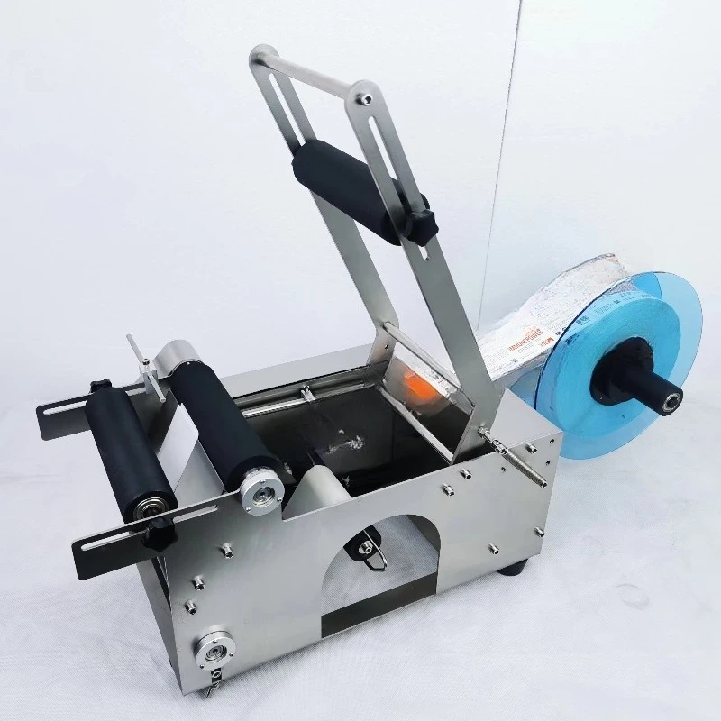 

MT-50S labeling machine, beverage water honey round bottle self-adhesive labeling machine