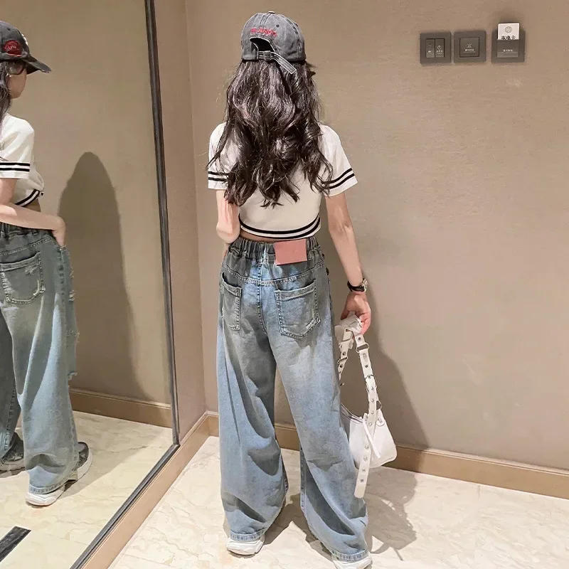 Jeans estivi per ragazze nuovo abbigliamento estivo per bambini in stile occidentale Casual pantaloni a gamba larga strappati per bambini medi e grandi all'ingrosso