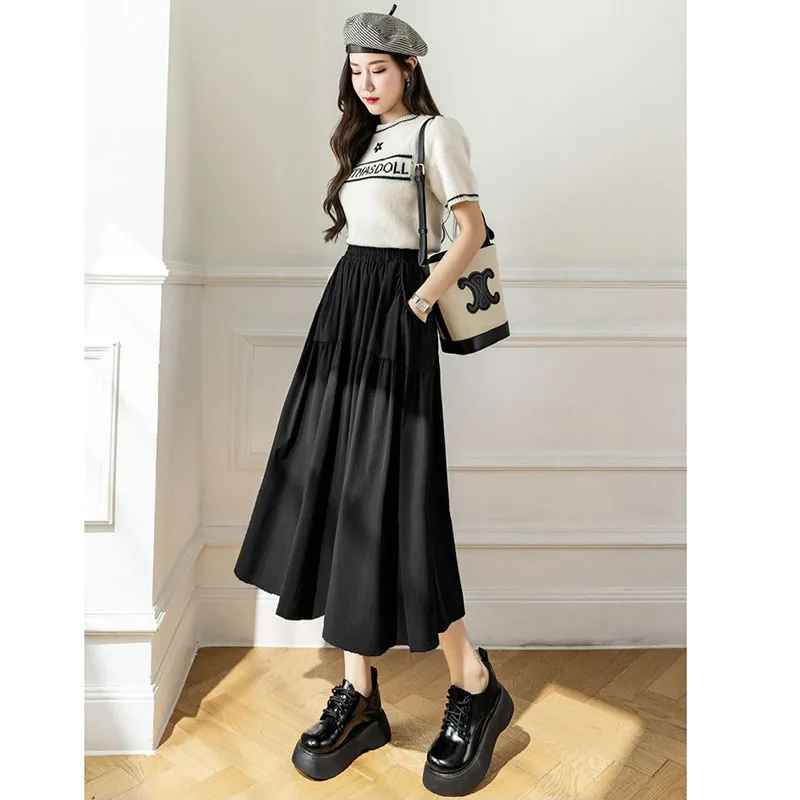 Saia midi branca para mulheres no verão 2025, novo design de cintura alta e emagrecimento, saia casual evasê que cobre os quadris