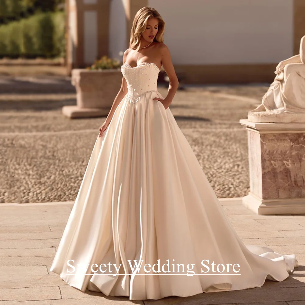 فستان زفاف مشد مخصص على شكل قلب بدون أكمام لؤلؤ سويب تراين بدون ظهر فيستدو نويفا المملكة العربية السعودية فستان زفاف