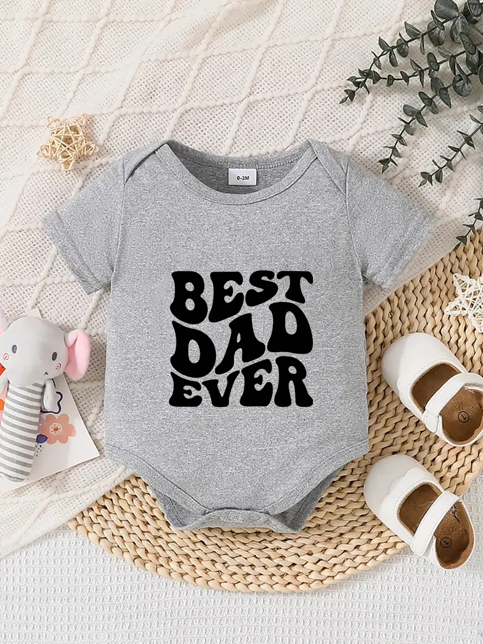 Playful letter-printed baby short-sleeve triangle bodysuit. Button closure for easy dressing, machine washable