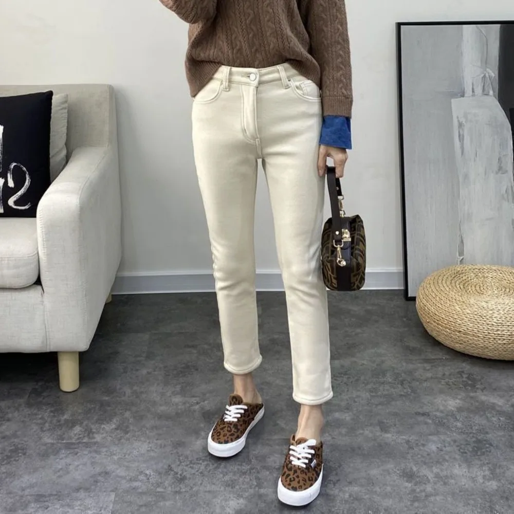 

Джинсы женские осенние утепленные тонкие модные джинсовые брюки универсальные с высокой талией утепленные шикарные однотонные женские джинсы до щиколотки