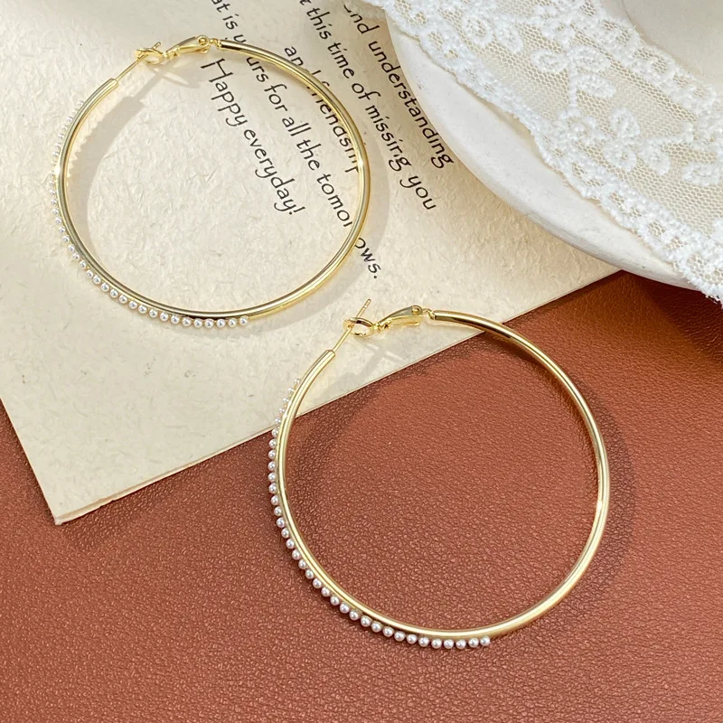 Personality exaggerated fashion simple pearl metal big earrings temperament light luxury versatile cold wind earrings wholesale