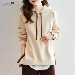 2023 New Spring and Autumn Fashion Trend Minimalist Casual Loose Oversize Long Sleeved Hem Split Hooded Tie Up Sweater for Women