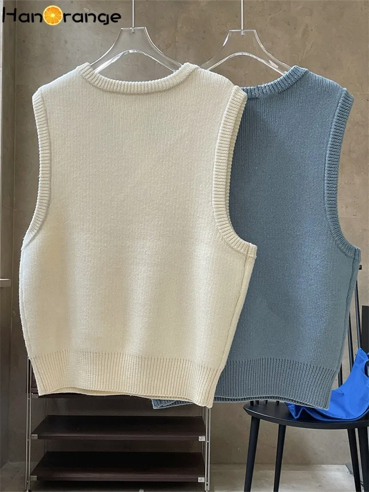 เสื้อกั๊กถักคอวีกำมะหยี่ขนแกะ HanOrange 2025 สำหรับฤดูใบไม้ผลิและฤดูใบไม้ร่วง เสื้อสเวตเตอร์แขนกุดทรงหลวมสำหรับผู้หญิง สีขาวนวล/ฟ้าหม่น