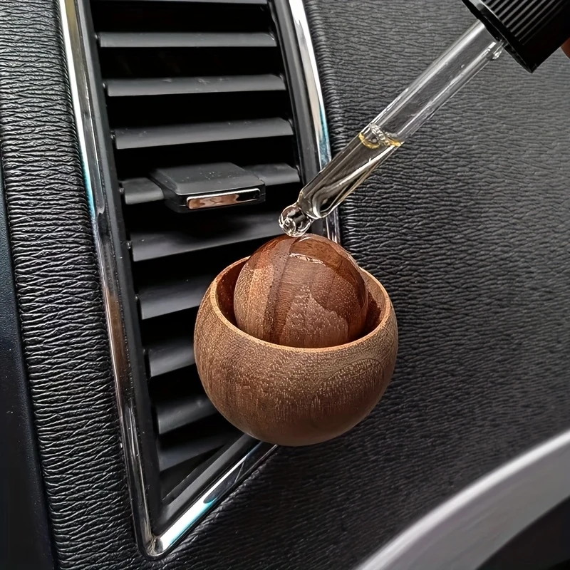 Original wooden aroma diffuser for vehicles, diffusing car interior with perfume and essential oils.