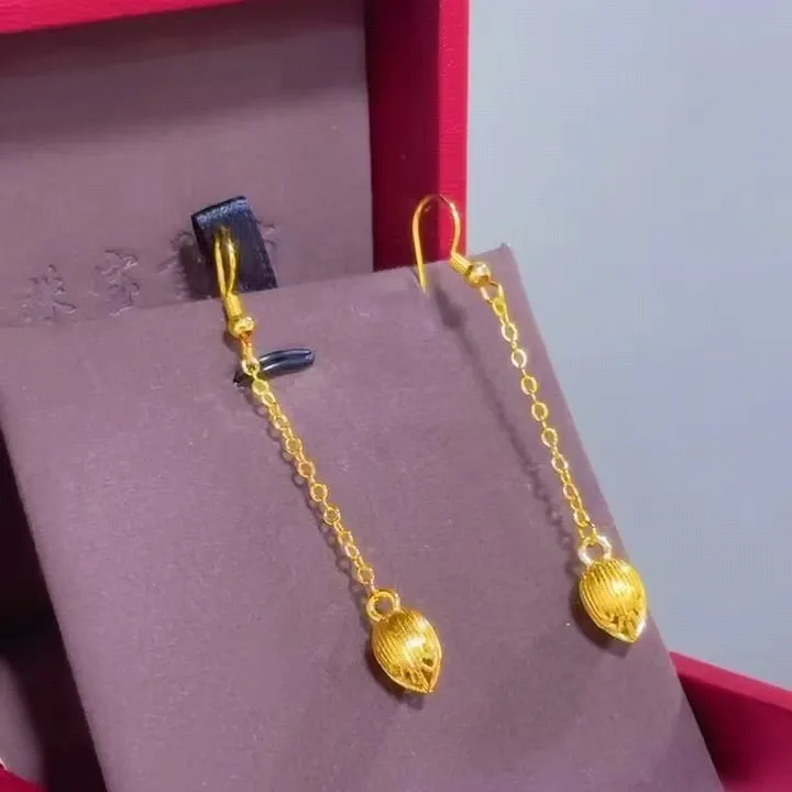 

Hollow Lotus Seed Earrings for Women, 24K Gold, AU999 | Sleek gold with onyx accents & hidden "Rhythm" engraving.