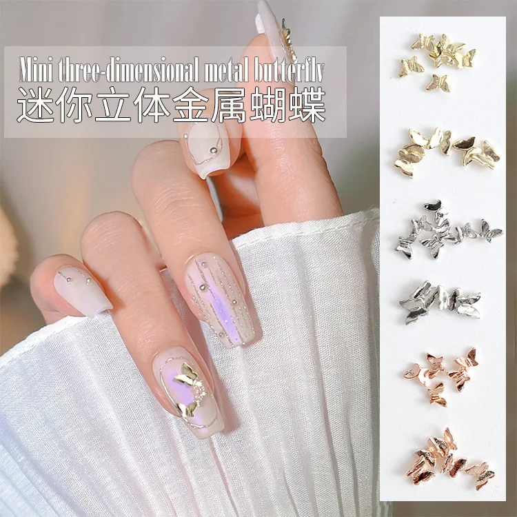 Neue 50 teile/beutel Französisch Rose Goldene Legierung Schmetterling Schmuck Mini 3D Glänzend Metall Kleine Schmetterling Diy Nail art Charms Dekorationen