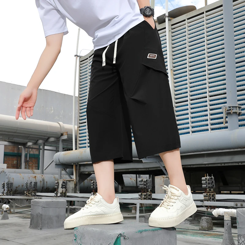 

Новые летние повседневные мужские шорты 2026 года, молодежные уличные свободные брюки с завязками, укороченные штаны, уличные шорты-джоггеры с эластичным поясом