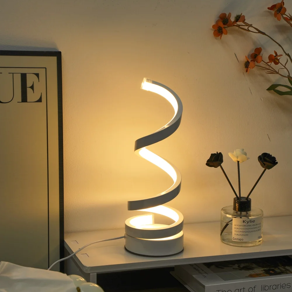 A Modern, Elegant White Spiral Desktop Lamp, Powered by USB with Three-Color Dimming, Suitable for Various Types of Rooms.