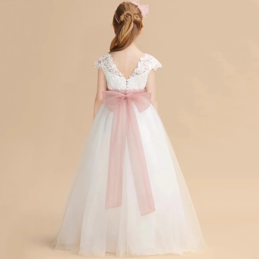 فساتين فتاة الزهور البيضاء المخصصة من التول مع شريط فيونكة وردي بدون أكمام لحفلات الزفاف وأعياد الميلاد والولائم