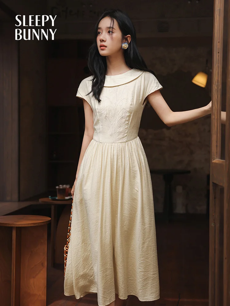 Elegante retro geborduurde jurk getextureerde zomer a-lijn maxi zonnejurk dames korte mouw vloeiende jurk lelie bloemen detail terug stropdas