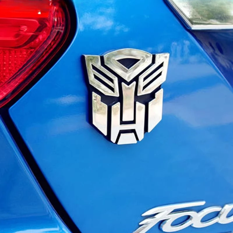 ในสต็อก Metamorphic ของเล่นโลหะผสมสติกเกอร์โลโก้เหมาะสําหรับรถยนต์,รถจักรยานยนต์,และเรือตกแต่งงานอดิเรก