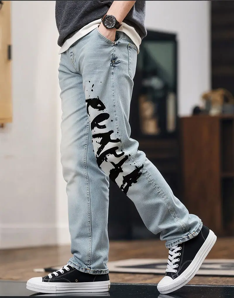 【HME】Men's Jeans | Ink‑Splash Letter Print Denim Pants, Light‑Wash Vintage Faded Denim Trousers, Graffiti‑Style Printed Casual Pants, Straight‑Leg Loose‑Fit Denim Bottoms, Street‑Inspired Daily Outfit For Men