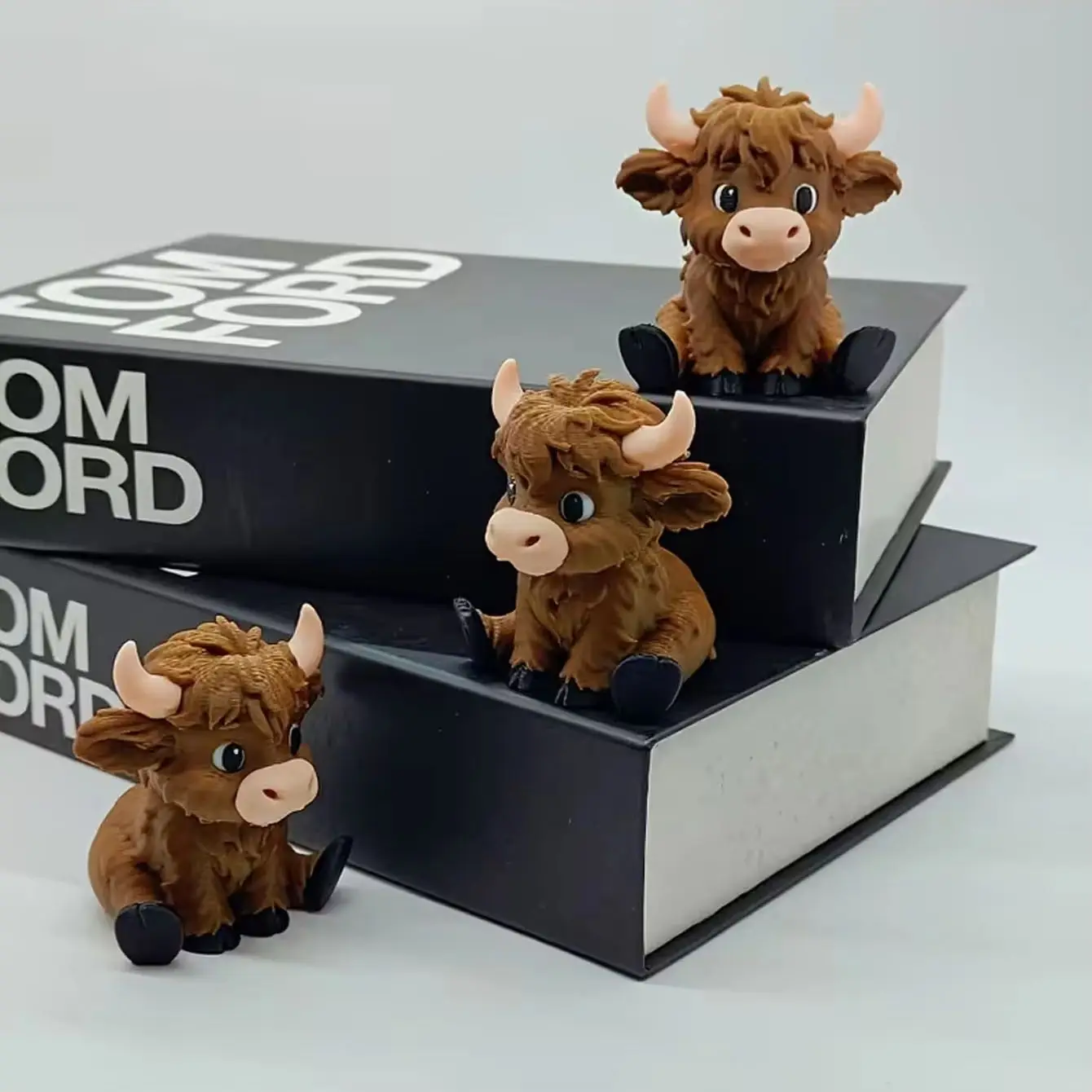 1 3D printed seated highland cow statue - a high-end home decoration car model, suitable as a gift for people