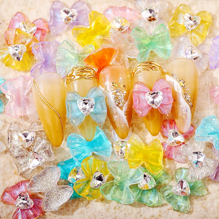 10 pz/lotto Ice Clear Nail Art Bow Charms Con Cuore Strass Gemma di Cristallo Trasparente Glitter Bowknot Unghie Decorazione Accessorio