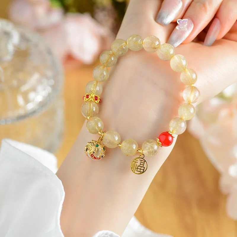 

Natural Yellow Rutilated Quartz With Gold Swallowing Bell, Fortune Pendant, New Women'S Bracelet Scen