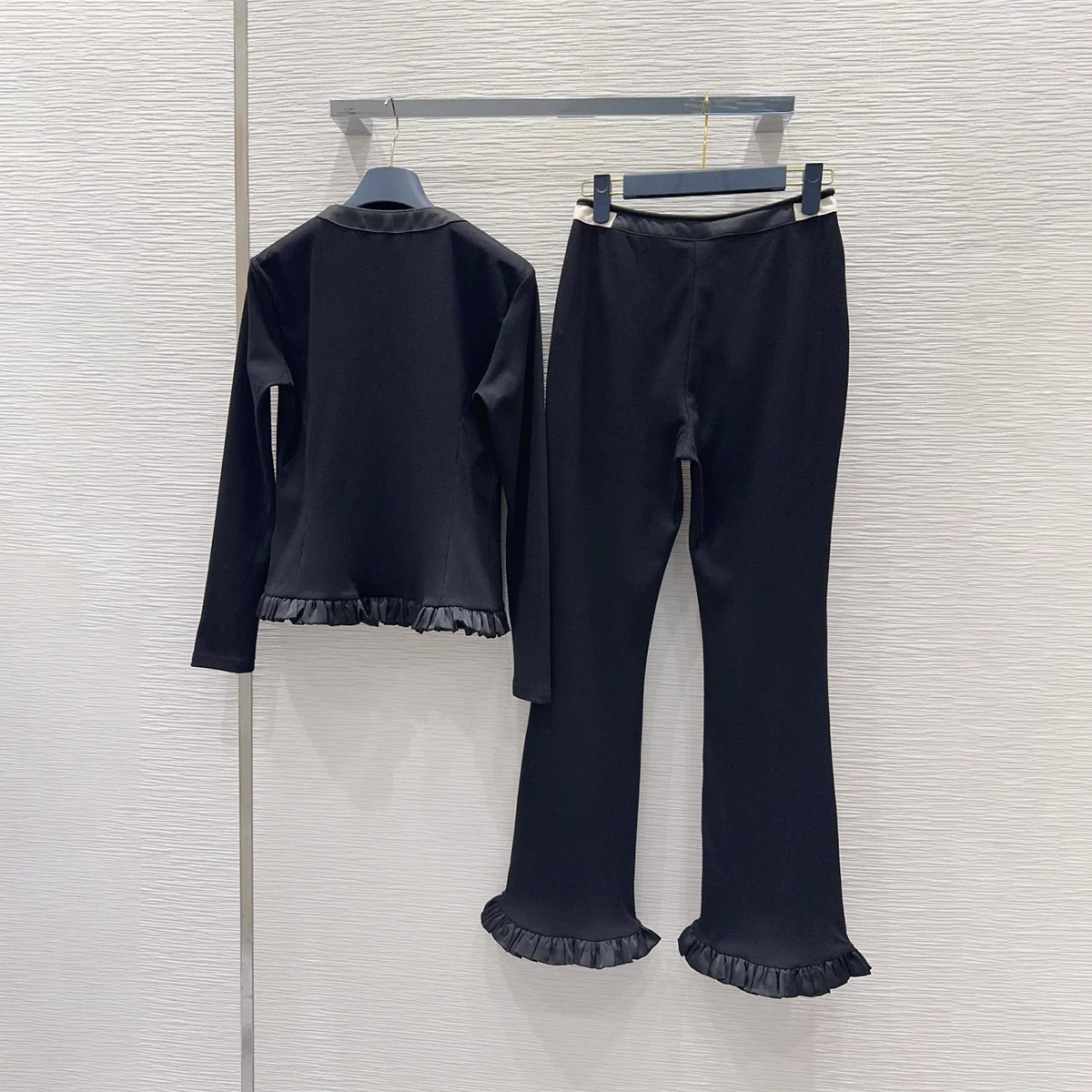 2026 High quality women's black fungus edge long sleeved top with ruffle edge and slightly flared pants two-piece set--202609114
