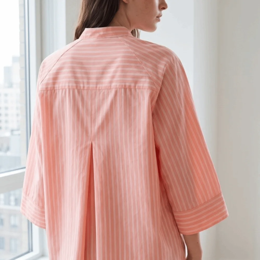 Gestreiftes, lockeres Hemd, elegantes Oberteil mit mittellangen Ärmeln und Knöpfen, europäisch-amerikanischer Stil, asymmetrische, lässige Bluse für Damen – Detail 4