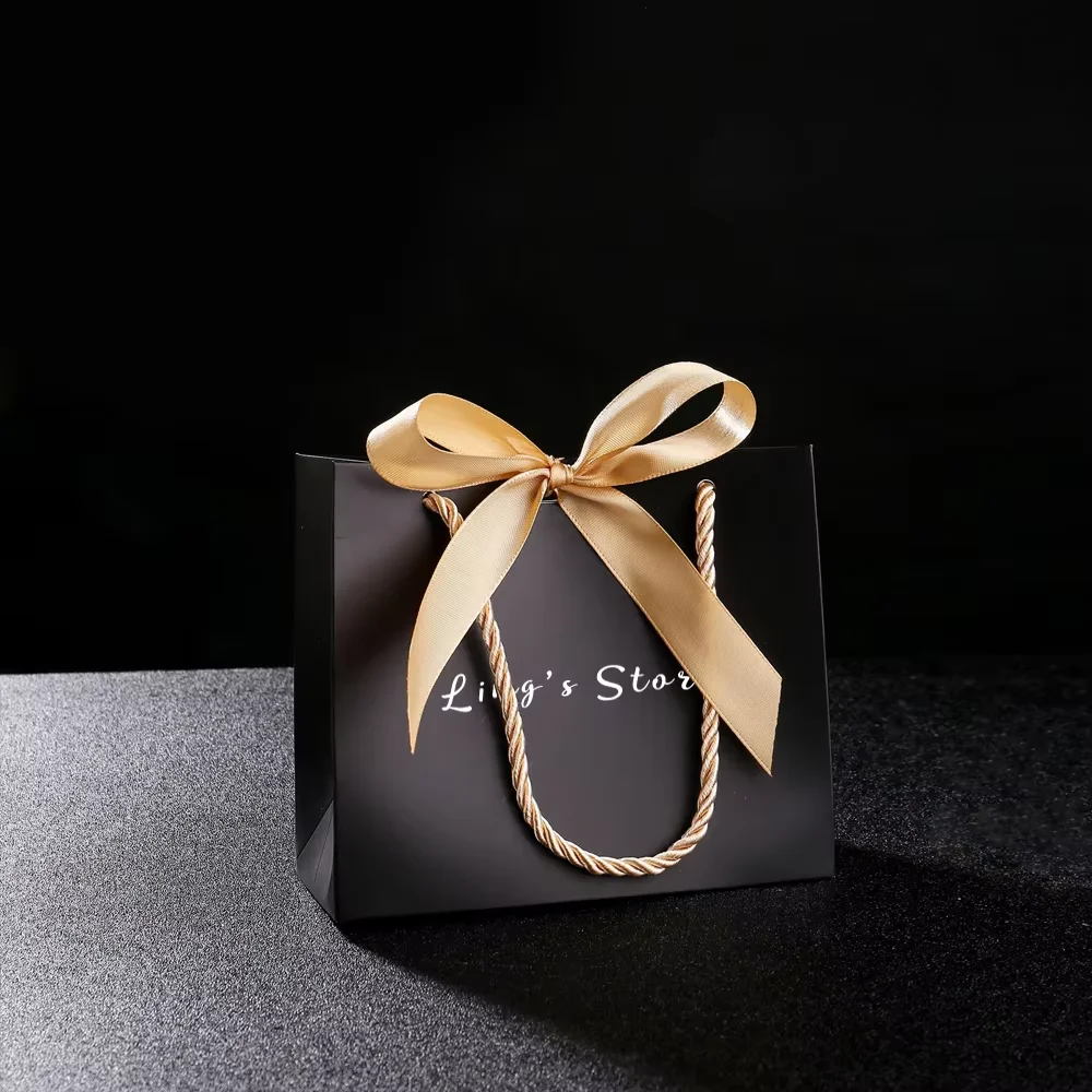 50/100Pcs Custom Logo 14x6x12cm Jewelry Paper Handle Bag Bowknot Ribbon Fashion Organizer Folder Handbag Cosmetic Packaging