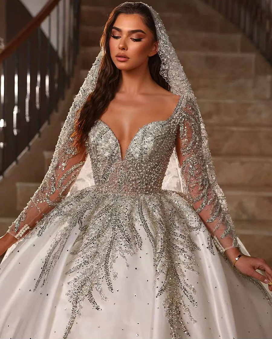 2025 Luxury Princess Satin Ball Gown Wedding Dress Lace Pearls Beaded Long Sleeves Sheer Neck White Bridal Gown Vestido De Novia