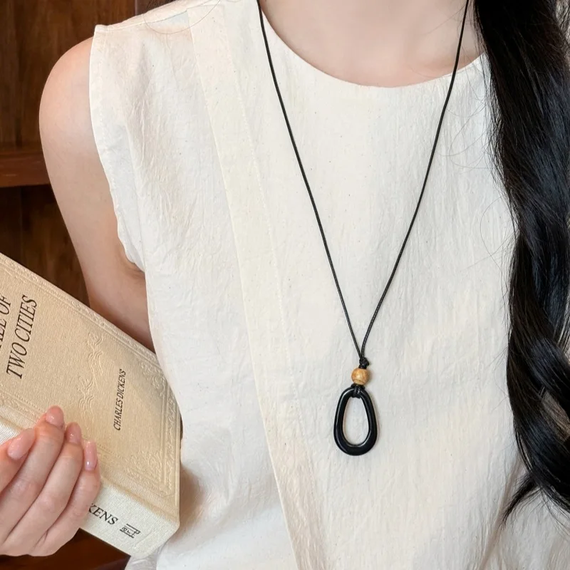 Elegant Oval Hollow Resin Pendant Black Rope Collarbone Necklace Minimalist Unique Versatile for Women Standard Length Black