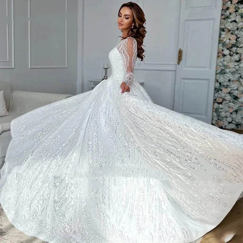 Lussuoso abito da sposa da donna bianco a trapezio in pizzo con perline 2026 Abito da sposa sexy con colletto trasparente a maniche lunghe personalizzato