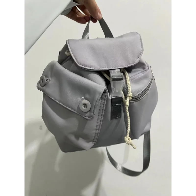 Fast Fashion Outdoor Leisure Large Capacity Korean Niche Design Pocket Button Drawstring Backpack Nylon Backpack Designer Bag