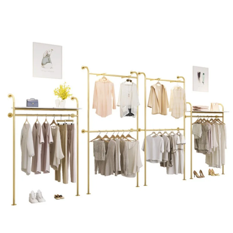 

Custom, Gold Stainless Steel Metal Hanging Rack Wall Mounted Display Racks for Clothing Store Showroom Boutique Decoration