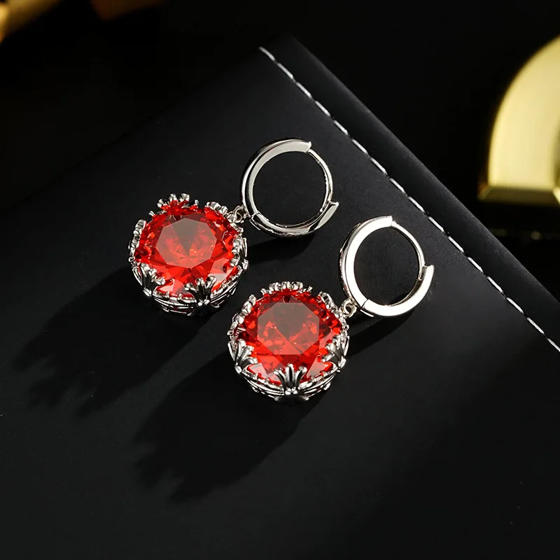 The s925 fashionable, lightly luxurious, and high-end garnet red earrings are retro, heavily inlaid with simple and exquisite de
