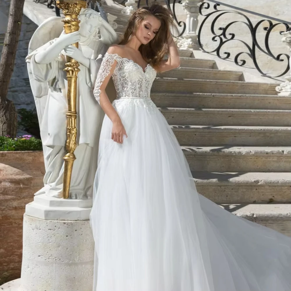 

Sexy Illusion A Line Wedding Dresses Sheer Scoop Neck Sequin Applique Long Sleeves Vestido De Noiva Bridal Gowns