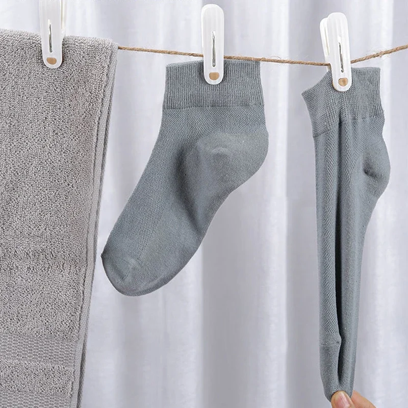 مشبك بلاستيك 12 غير وسم للتجفيف ، ملابس ثابتة مقاومة للرياح ، مشبك جوارب ، بياضات سرير ، مطاط ناعم ، مانع للإنزلاق ، أبيض ناعم