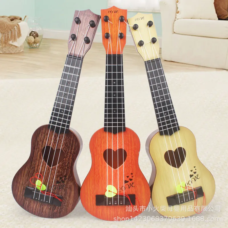 

1Pcs Mini Plastic Simulation Ukulele Toys For Children Small Guitar Beginner Musical Instrument Toys Kids Educational Toys Gifts